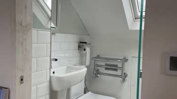 Combined shower/bathtub, deep-soaking bathtub, towels