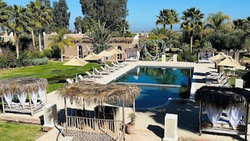 2 outdoor pools, pool umbrellas, pool loungers