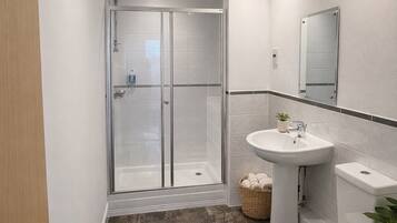 Shower, towels, soap, toilet paper