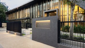 A modern building with a prominent sign reading 'THE LENNOX.' - The Lennox by Clifton Homes (Accra)