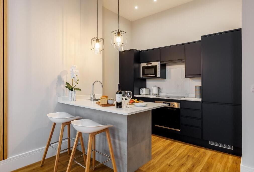 Apartment, 1 King Bed, Kitchen | Private kitchen | High chair