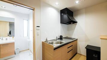 Villa | Private kitchen | Full-size fridge, microwave, cookware/dishes/utensils