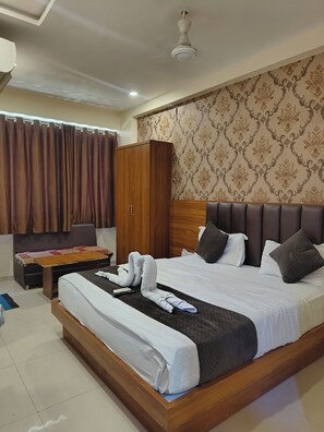 Deluxe Double Room, City View | Desk, laptop workspace, iron/ironing board, free WiFi - Hotel Blue Star (Ahmedabad)