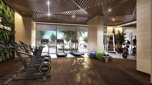 A gym with treadmills, exercise balls, and weight equipment. - Novotel Dhahran Hotel & Residences (Dhahran)