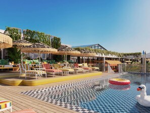 A pool area with lounge chairs, umbrellas, and a swan float. - Mama Shelter Cape Town (CAPE TOWN)
