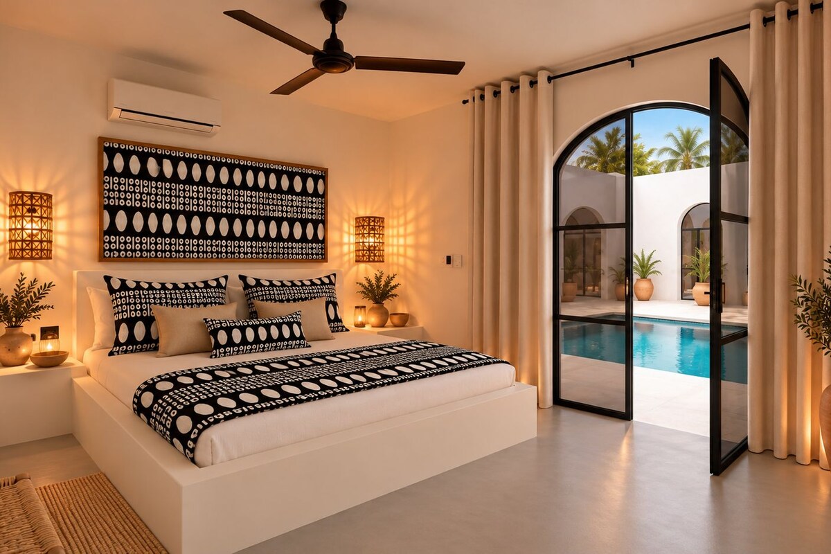 A modern bedroom with a large bed, a ceiling fan, a wall-mounted air conditioner, and a view of a swimming pool through a glass door.