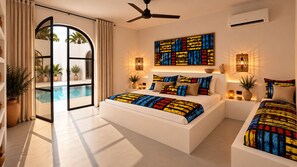 A modern bedroom with a large bed, a ceiling fan, and a view of a pool through an open door. - Coco Canel (Mbour)