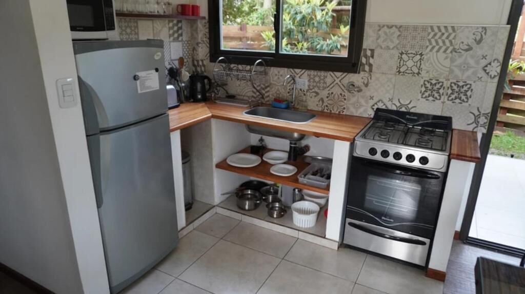 Apartment, Patio, Garden View | Private kitchen | Fridge, microwave, stovetop, cookware/dishes/utensils
