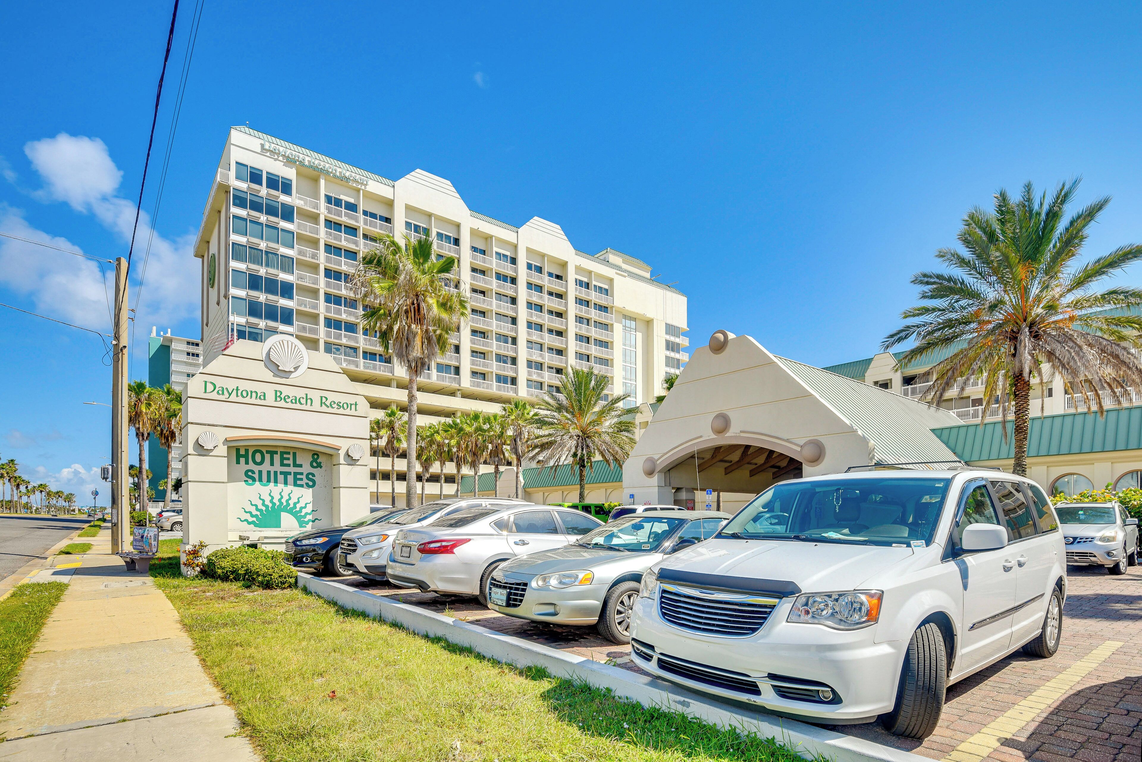 A hotel with a sign reading "Daytona Beach Resort Hotel & Suites".