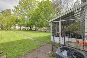 A covered outdoor area with a lawn, a pathway, and a grill. - Walk to Falls, Casino! Niagara Family Home w/ Yard (Niagara Falls)