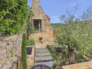 A stone house with a small balcony, a wooden staircase, and potted plants. - Authentic family home near village - 6 ppl (Domme)