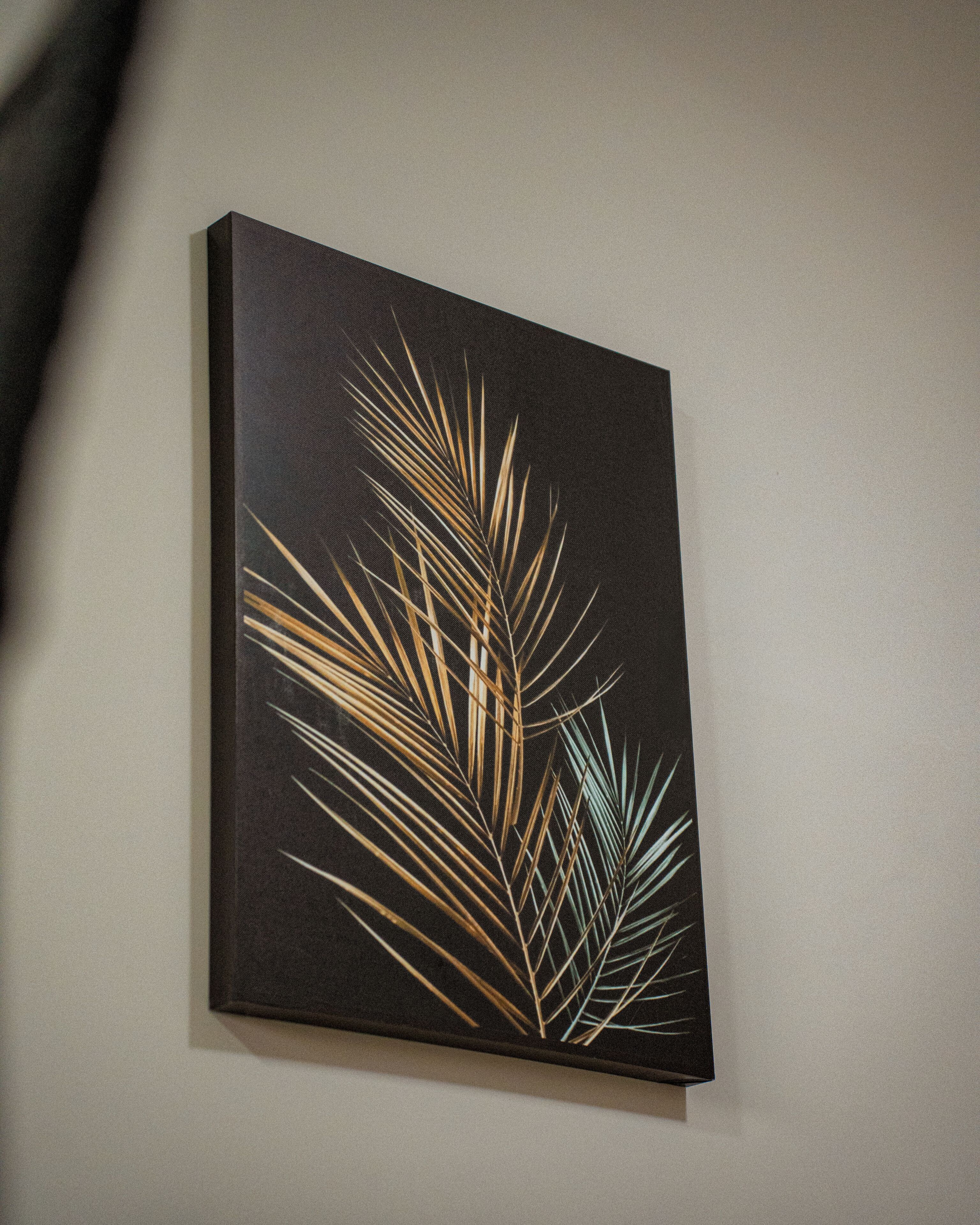 A framed artwork on a wall.