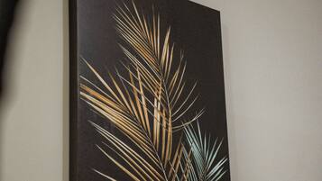 A framed artwork on a wall.