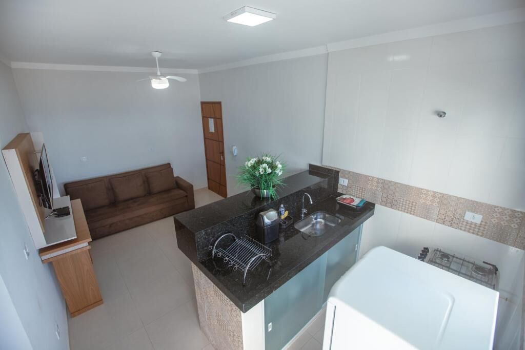 Apartamento conforto, varanda coberta, vista para a cidade | Área de estar