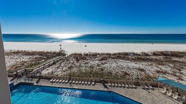 A pool with a view of the beach and ocean. - Phoenix X 508 1 Bedroom Condo (Orange Beach)