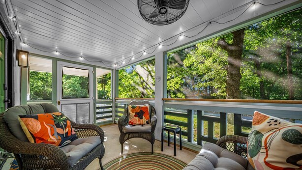A covered porch with wicker furniture, a fan, and string lights. - 'Lil' Gem'-restored 1960's bungalow (Mentone)