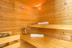 A wooden sauna with benches, a thermometer, and a bucket. - Istrian Villa Stella for 8: Pool & Sauna (Labin)