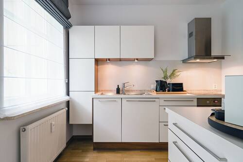 Apartamento familiar, 2 habitaciones, vistas al patio | Cocina privada | Cafetera o tetera, hervidor eléctrico, tostadora y trona infantil