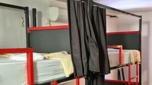 A bunk bed room with a wooden floor and a white ceiling. - Majka Guest House (Kotor)