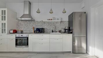 Family Apartment, Balcony, City View | Private kitchen | Coffee/tea maker, electric kettle, toaster, high chair