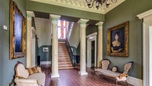 A grand hallway with a staircase, ornate columns, and classical furniture. - Ballynacree Manor House  (Ballymoney)