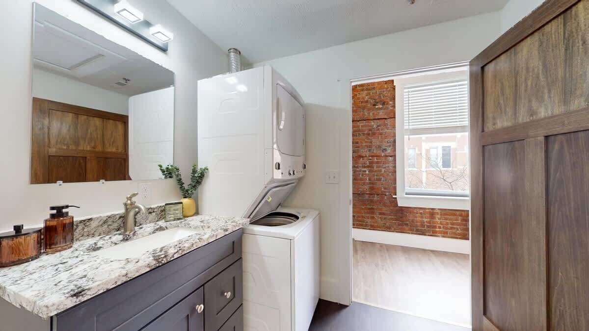 Shower, hair dryer, towels, shampoo