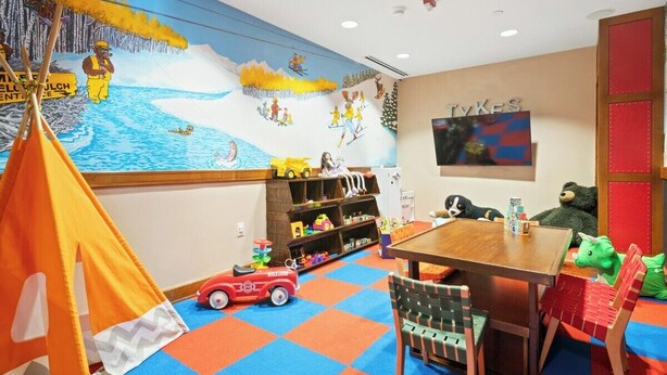 A children's playroom with a mural, a red toy car, and a table with toys. - 3BR SKI-IN/OUT JAN 2-9, FREE LIFT TICKETS -FORMALLY TIMBERS/RITZ BACHELOR GULCH (Avon)