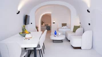 Suite Deluxe, vista al mar | Área de sala de estar