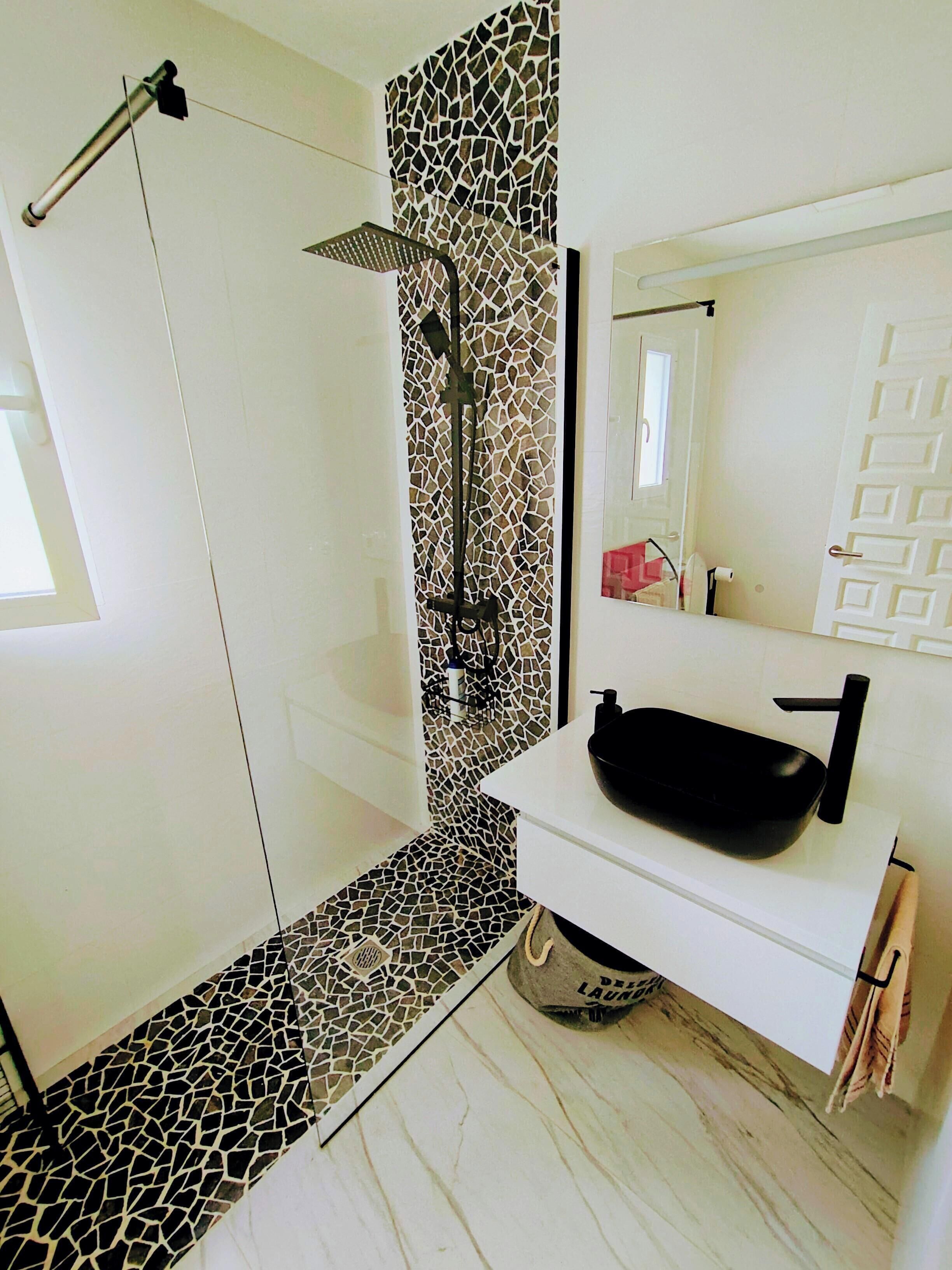 Shower, towels, soap, toilet paper