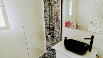 Shower, towels, soap, toilet paper