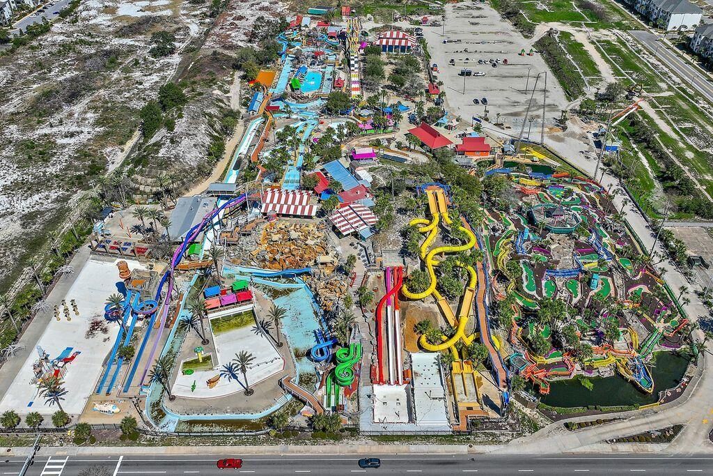 An aerial view of a water park with various slides and pools.