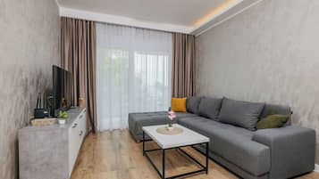 Classic Apartment, 1 Bedroom, Balcony | Living area | Flat-screen TV