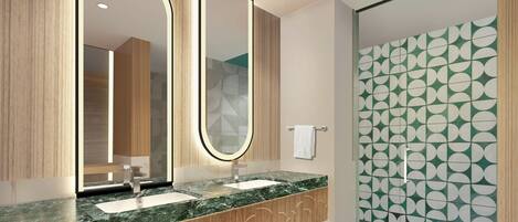 Un baño moderno con encimera de mármol, tocador de madera y pared de ducha con diseño geométrico.