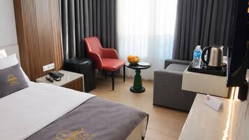 Deluxe Double Room, Balcony, City View | Minibar, in-room safe, desk, laptop workspace