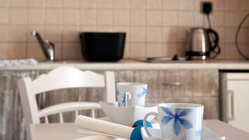 Fridge, coffee/tea maker, cookware/dishes/utensils