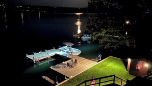 A dock with a pool, a small deck area, and a flag. - It’s Great to be on Cayuga (Ithaca)