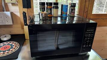 Microwave, coffee/tea maker, toaster, cookware/dishes/utensils