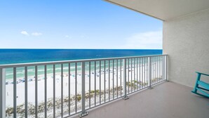 A balcony with a view of a beach and ocean. - Summit Beach Resort 1429 (Panama City Beach)