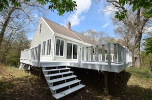 A house with a deck, a staircase, and a chimney. - Home near the Indiana Dunes National & State Parks! (Michigan City)