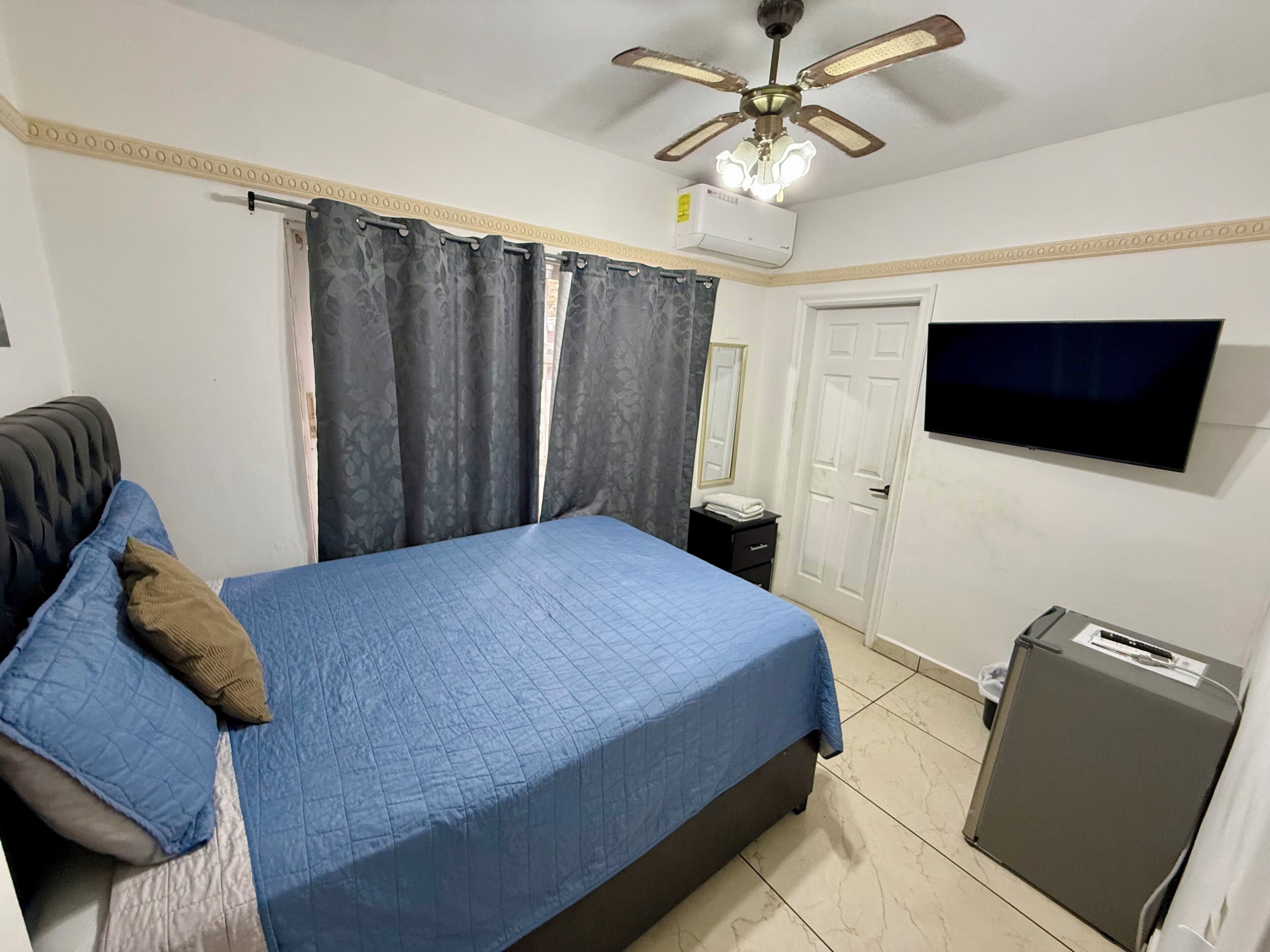 Economy Room, Patio | Down comforters, iron/ironing board, free WiFi, bed sheets