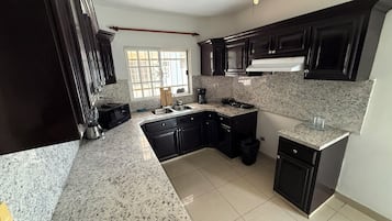 Microwave, stovetop, dishwasher, cookware/dishes/utensils