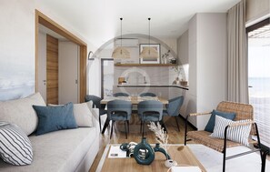 Ein modernes Wohnzimmer mit einer Couch, Sesseln, einem Esstisch und einem Korbstuhl.
