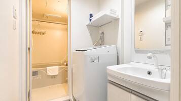 Separate tub and shower, hair dryer, towels, soap
