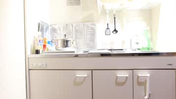 Fridge, microwave, stovetop, cookware/dishes/utensils