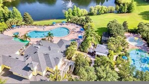 A resort with a large swimming pool, a smaller pool, and a water park area. - Go 38 - Bahama BAY in Davenport (Davenport)