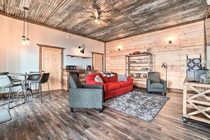A rustic interior with a dining area, kitchen, and seating space. - Red Door House, Rabun Gap (Rabun Gap)