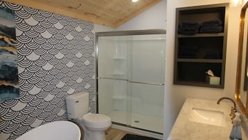 Shower, hair dryer, towels, toilet paper