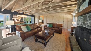 A spacious living room with wooden beams, leather sofas, a pool table, and a fireplace. - Sunrise Mountain Views, Hot Tub, Fire Pit & Spacious Retreat Near Downtown Boone (Boone)