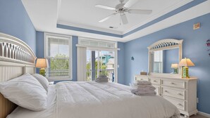 A bedroom with a bed, a dresser, a ceiling fan, and a window with blinds. - 6 Sunset Island Drive 3F (Ocean City)