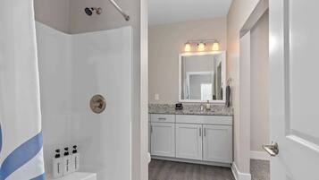 Shower, hair dryer, towels, shampoo